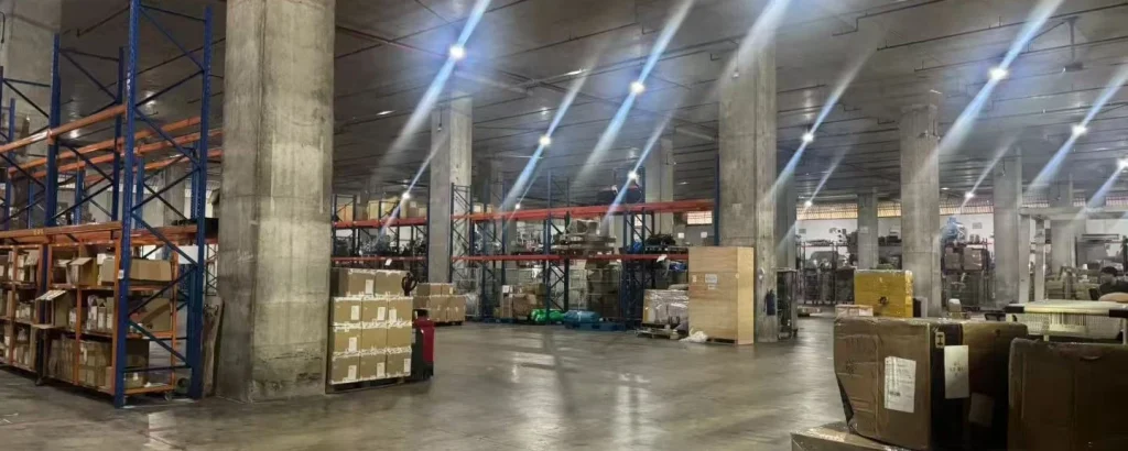 Palletised cartons staged in a dispatch warehouse before container loading